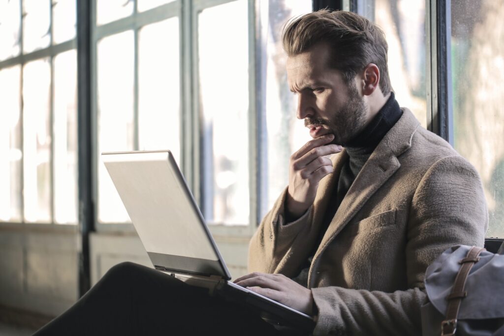 Confused man staring at screen